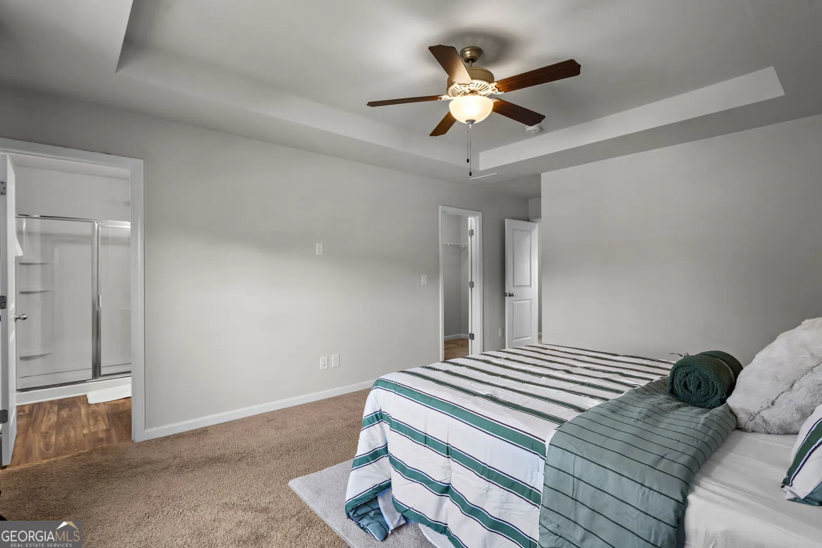 Primary bedroom, with the doorway to its bathroom
