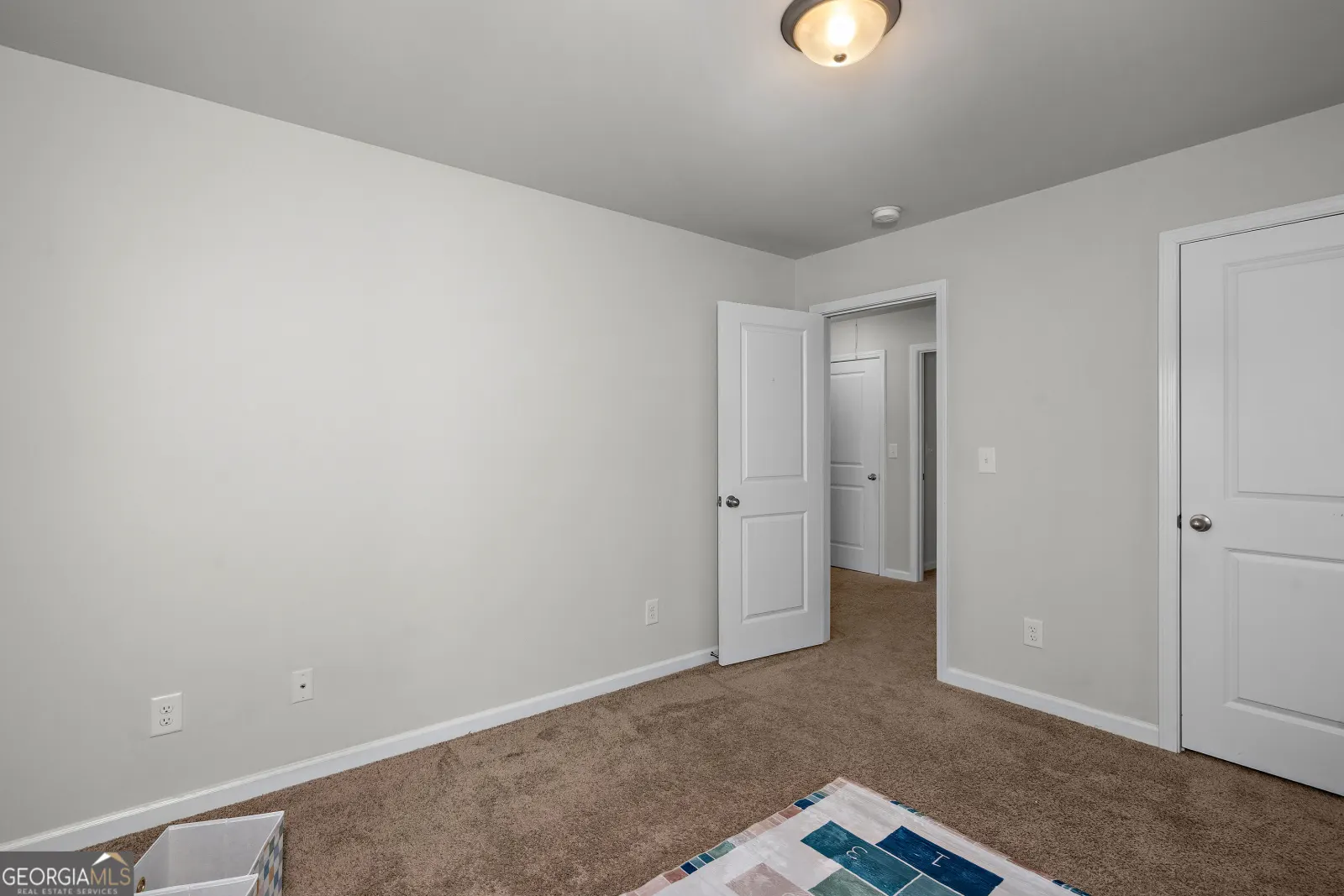 Upstairs bedroom with a closet and a door to the hall