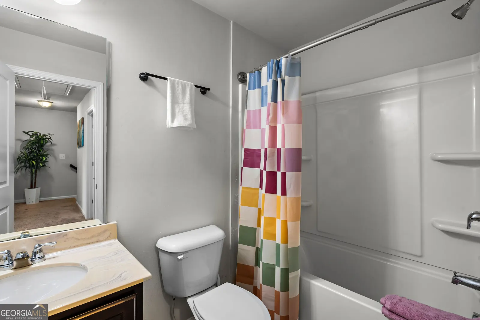 Upstairs hall bathroom with a tub and shower