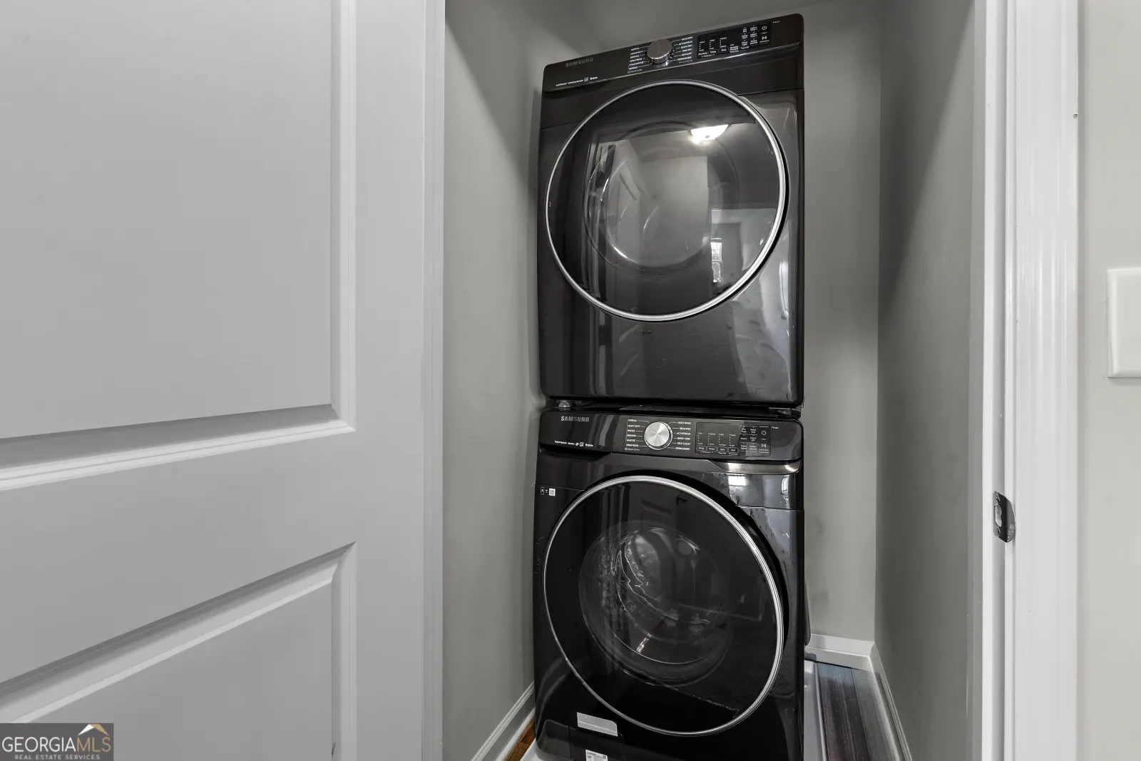 Stacked washer and dryer in the upstairs laundry closet