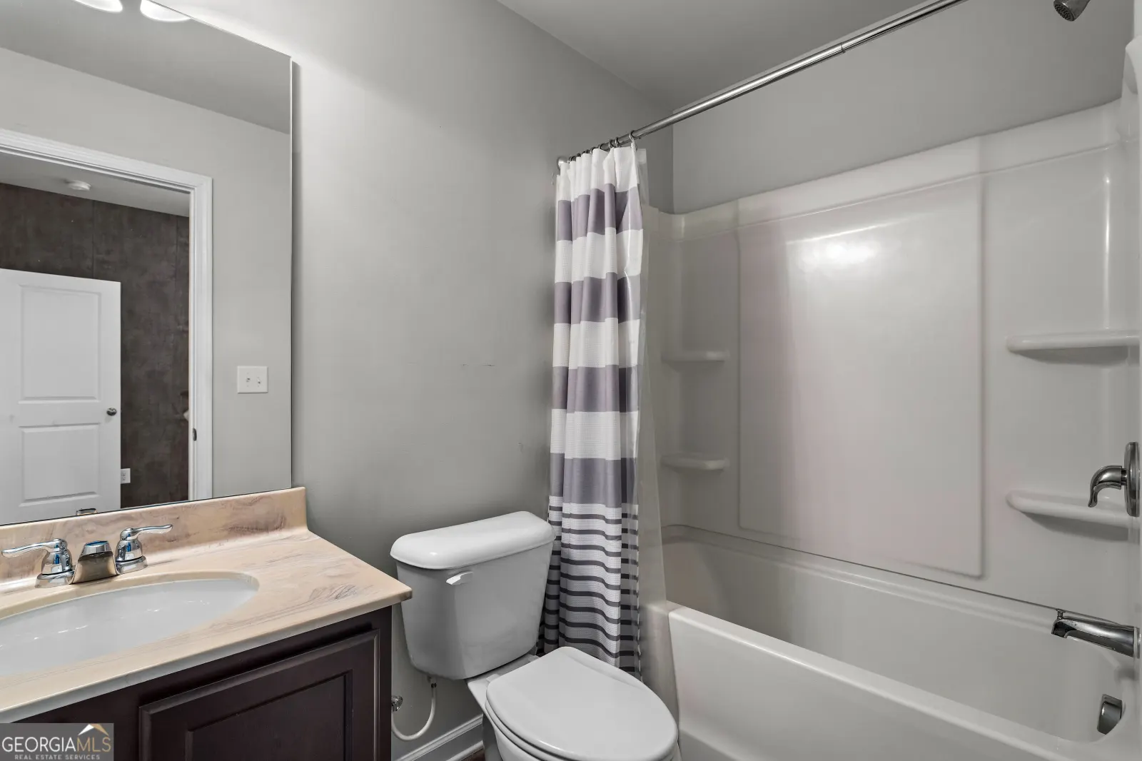 Entry-level full bathroom with a tub and shower