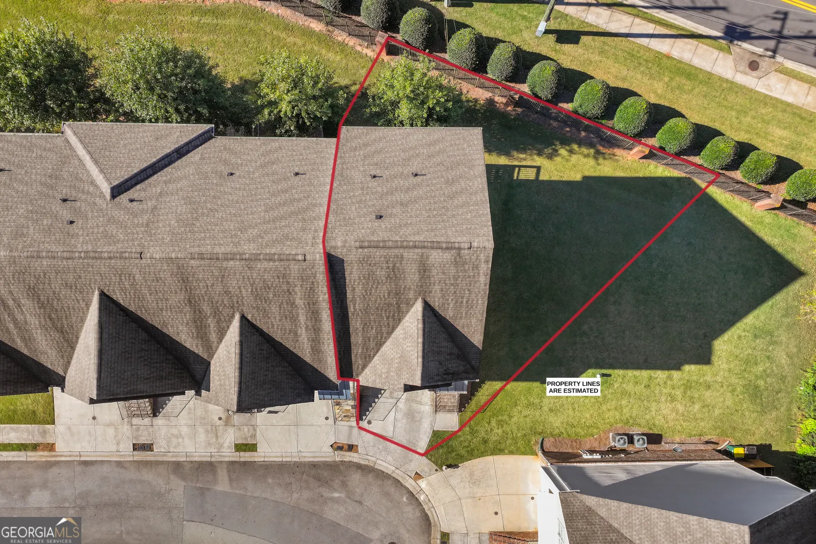 Aerial view of the lot, with estimated property lines drawn on the corner